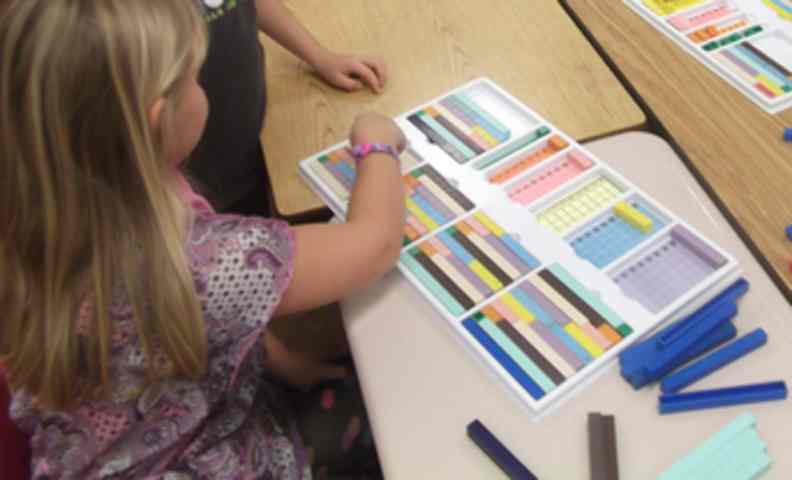 Base ten blocks, mortensen math, top tray, fun math activities, girl playing math